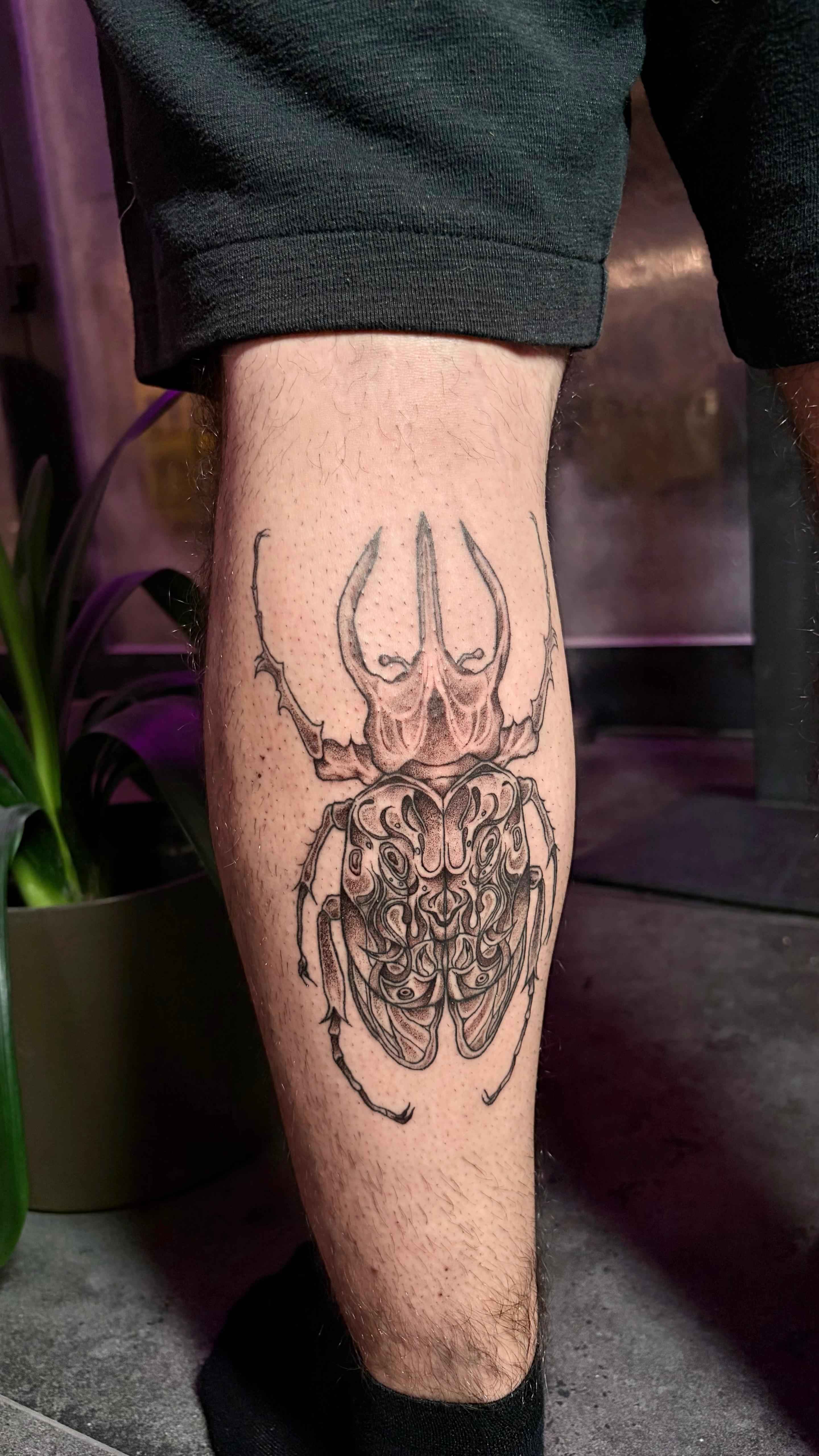 Illustrative blackwork tattoo