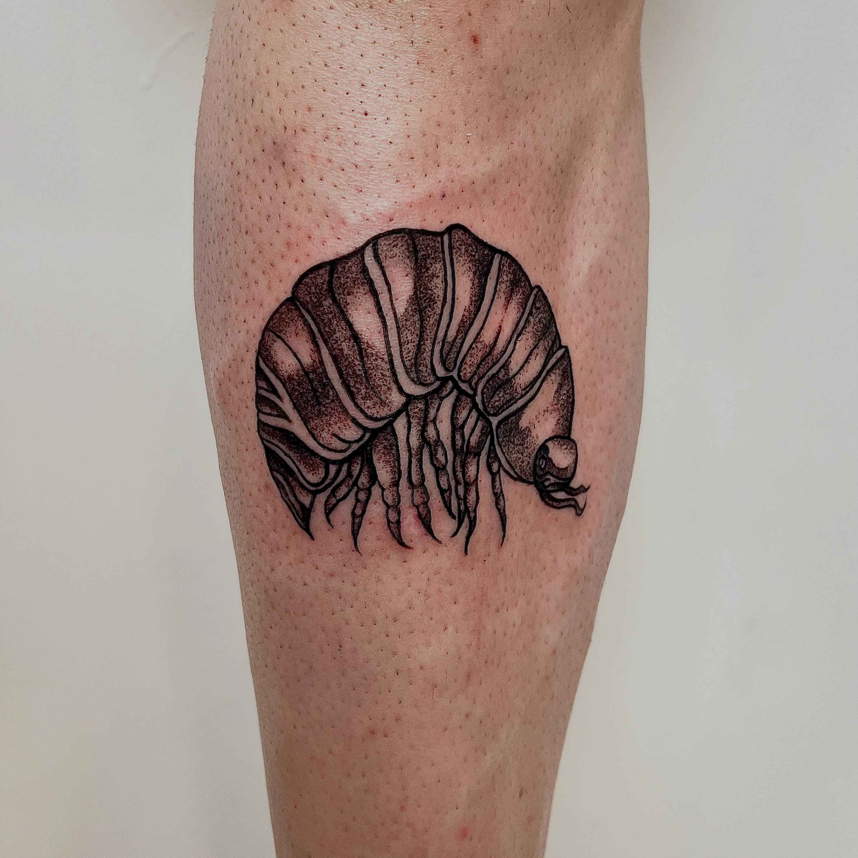 Illustrative blackwork tattoo
