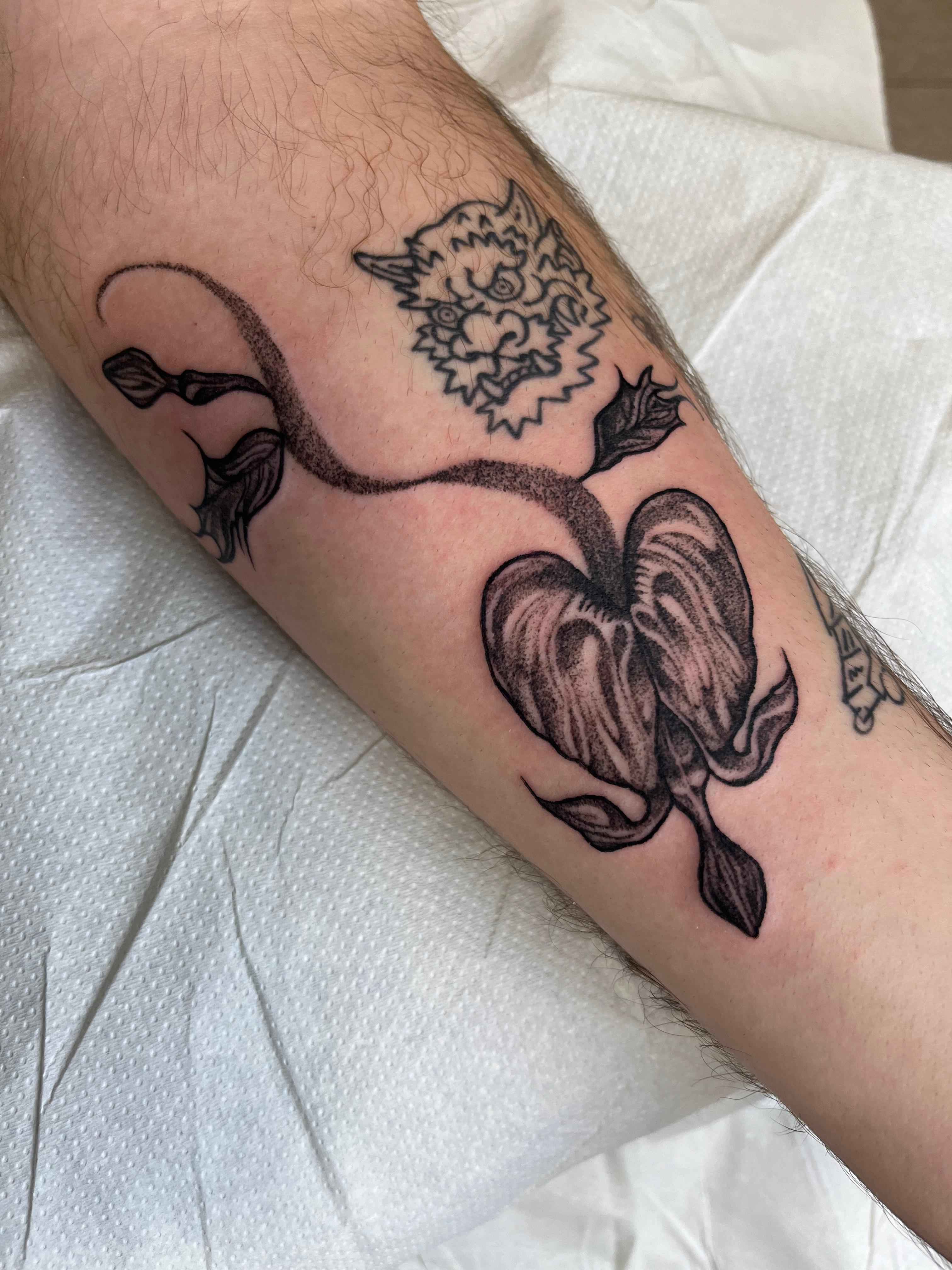 Illustrative blackwork tattoo